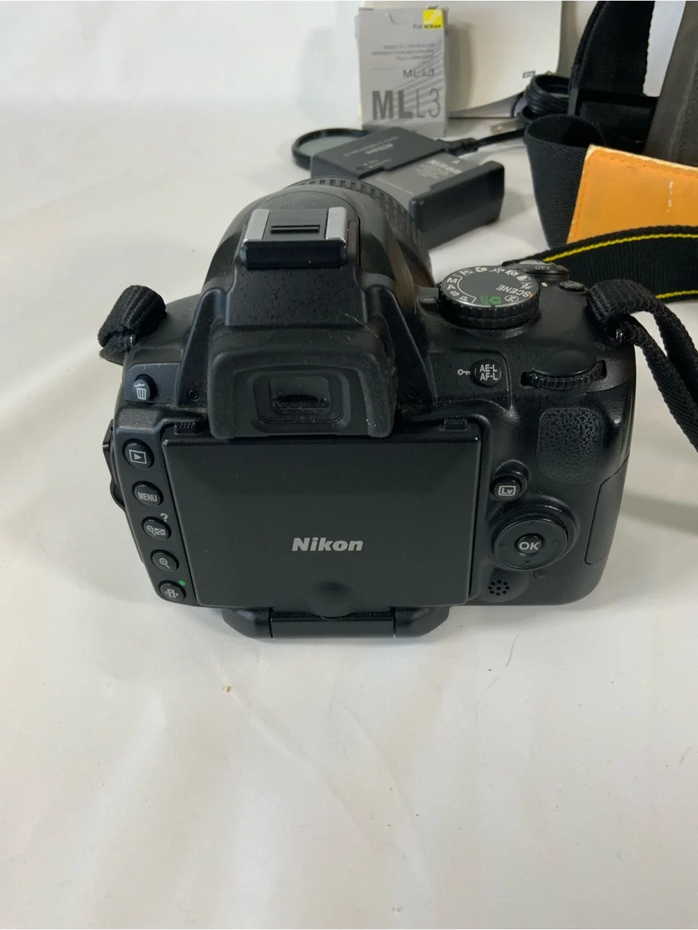 Nikon DSLR Camera with Black Body and Yellow-Orange Interior Bag